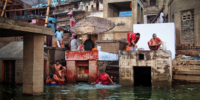 indian locals washing and bathing in the river
