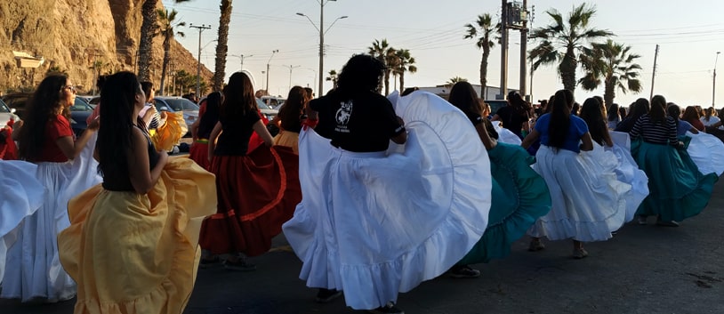 women with wide skirts dancing in chile