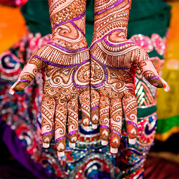 hands with henna painting in india