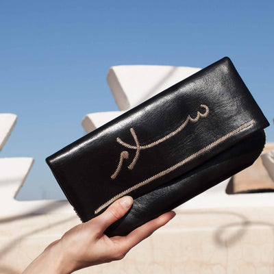front view black abury salam clutch bag