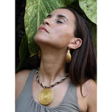 Mesclado model wearing a golden grass and miçangas necklace by she is from the jungle