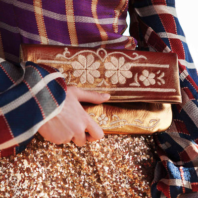 front view bronze and beige abury floral leather clutch bag