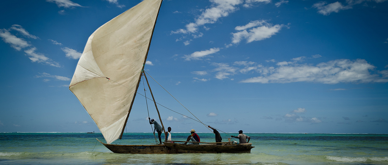 locals on a sailing boat in tanzania