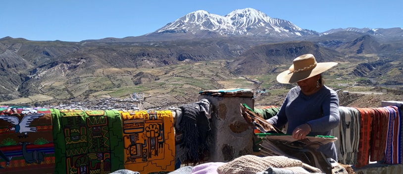 artisan selling chilean handicrafts in the mountains
