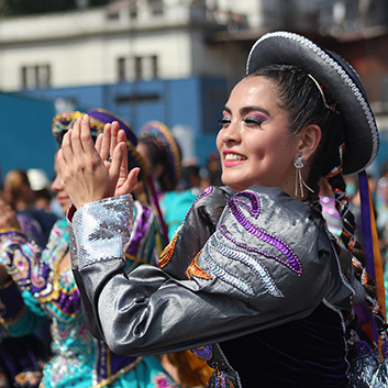 peruvian woman dancing and clapping